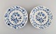 Two antique Meissen "Blue Onion" dinner plates in hand-painted porcelain. Early 
20th century.

