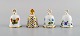 Four Herend table bells in hand-painted porcelain with flowers and gold 
decoration. 1980s.
