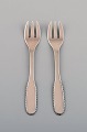 Two Evald Nielsen number 14 pastry forks in hammered silver (830). 1920s.
