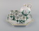 Meissen Indian Green sake / schnapps set on tray in hand-painted porcelain with 
foliage and gold decoration. Mid-20th century.
