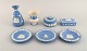 Wedgwood, England. Three bowls/dishes, two vases and two lidded jars in light 
blue and white stoneware with classicist scenes in white. Early 20th century.
