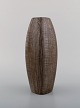 Ingrid Atterberg for Upsala-Ekeby vase in glazed stoneware. Beautiful glaze in 
brown shades with grooved design. Mid 20th century.
