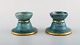 Josef Ekberg for Gustavsberg. A pair of art deco candlesticks in glazed 
ceramics. Beautiful blue-green glaze and gold decoration. 1930s.
