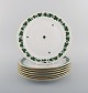 Seven Herend Green Grape Leaf & Vine dinner plates in hand-painted porcelain. 
Mid-20th century.
