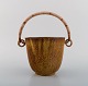 Arne Bang (1901-1983), Denmark. Ice bucket in glazed ceramics with handle in 
wicker. Model number 15. 1940s / 50s.
