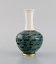 Hackefors, Sweden. Vase in hand-painted porcelain. Green and blue shades with 
gold decoration. Mid-20th century.
