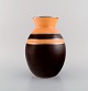 Boch Freres Keramis, Belgium. Rare art deco vase in glazed ceramics. Brown and 
orange glaze with silver decoration. 1930s.
