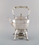 Tiffany & Company, New York. Swing teakettle with burner in sterling silver. 
Early 20th century.
