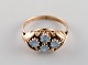 Scandinavian jeweler. Ring in 14 carat gold adorned with light blue 
semi-precious stones. Mid-20th century.
