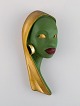 Schaubach, Germany. Art deco female face in hand-painted glazed ceramics. 
Mid-20th century.
