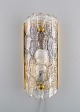 Carl Fagerlund for Orrefors. Wall lamp in clear art glass and brass. Swedish 
design, 1960s.
