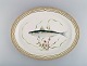 Large Royal Copenhagen Fauna Danica serving dish in hand-painted porcelain with 
fish and gold decoration. Model number 19/3520. Dated 1969-1974.

