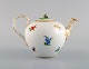 Antique Meissen teapot in hand-painted porcelain with flowers and gold 
decoration. Late 19th century.
