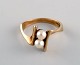 Danish jeweler. Modernist vintage ring in 8 carat gold adorned with two cultured 
pearls. Mid-20th century.
