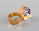 Swedish jeweler. Modernist vintage ring in 18 carat gold adorned with 
semi-precious stone. Dated 1967.
