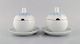Bjørn Wiinblad for Rosenthal. Two Lotus sauce boats in porcelain decorated with 
light blue lotus leaves. 1980s.
