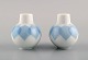 Bjørn Wiinblad for Rosenthal. Lotus salt and pepper shaker in porcelain 
decorated with light blue lotus leaves. 1980s.
