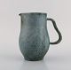 Arne Bang (1901-1983), Denmark. Jug in glazed ceramics. Beautiful glaze in 
shades of blue-green. 1940s / 50s.
