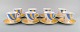 Set of eight Hermès Circus porcelain coffee cups with saucers. Late 20th 
century.
