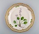 Royal Copenhagen Flora Danica plate in openwork porcelain with hand-painted 
flowers and gold decoration. Model number 20/3526. Dated 1969-74.
