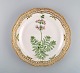 Royal Copenhagen Flora Danica plate in openwork porcelain with hand-painted 
flowers and gold decoration. Model number 20/3526. Dated 1958.

