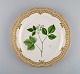 Royal Copenhagen Flora Danica plate in openwork porcelain with hand-painted 
flowers and gold decoration. Model number 20/3526. Dated 1966.
