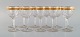 Baccarat, Frankrig. 11 art deco vinglas i mundblæst krystalglas med 
gulddekoration i form af blade. 1930