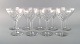 Val St. Lambert, Belgium. Nine red wine glasses in clear mouth-blown crystal 
glass. 1930s.

