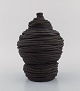 European studio ceramicist. Vase in black glazed ceramics. Late 20th century.
