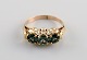 Scandinavian jeweler. Classic ring in 14 carat gold adorned with three 
semi-precious stones. 1930s.

