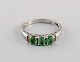 Scandinavian jeweler. Vintage ring in 9 carat white gold adorned with three 
green semi-precious stones. Mid-20th century.
