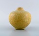 Carl Halier for Royal Copenhagen. Vase in glazed stoneware. Beautiful eggshell 
glaze in yellow shades. Mid-20th century.
