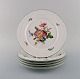 KPM, Berlin. Five antique porcelain plates with hand-painted flowers and 
butterflies. Early 20th century.
