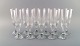 Baccarat, France. 11 art deco Assas champagne flutes in mouth-blown crystal 
glass. 1930