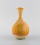Sven Wejsfelt (1930-2009), Gustavsberg Studiohand. Unique vase in glazed 
ceramics. Beautiful glaze in mustard yellow shades. Dated 1984.
