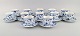 Twelve Royal Copenhagen Blue Fluted Half Lace coffee cups with saucers. Model 
number 1/719. Mid-20th century.
