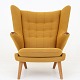 Roxy Klassik 
presents: 
Hans J. 
Wegner / AP 
Stolen
AP 19 - 
Reupholstered 
Papa Bear Chair 
in yellow 
textile ...