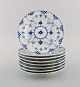 Eight Royal Copenhagen Blue Fluted Full Lace Plates. Model number 1/1087. 1960s.
