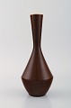 Carl Harry Stålhane for Rörstrand. Narrow neck vase in glazed ceramics. 
Beautiful glaze in brown shades. Mid-20th century.
