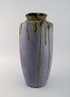 Leon Pointu (1879-1942), France. Large art deco vase in glazed stoneware. 
Beautiful running glaze on a purple background. 1930s.
