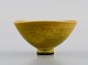 Berndt Friberg (1899-1981) for Gustavsberg Studiohand. Miniature bowl in glazed 
stoneware. Beautiful glaze in yellow shades. 1960s.
