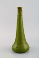 Alexandre Bigot (1862-1927), France. Antique vase in glazed stoneware. Beautiful 
olive green glaze with crystals. Early 20th century.
