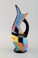 Longwy, France. Pigalle pitcher in hand-painted glazed ceramics. Abstract 
polychrome decoration. Mid-20th century.
