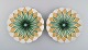 To antikke Meissen tallerkener i håndmalet porcelæn. Lysegrønne blomster og 
gulddekoration. Tidligt 1900-tallet.
