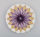 Antique Meissen plate in hand-painted porcelain. Purple flower and gold 
decoration. Early 20th century.
