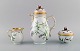Fürstenberg, Germany. Coffee pot, sugar bowl and cream jug in hand-painted 
porcelain with flowers and gold decoration. Flora Danica style. Mid-20th 
century.
