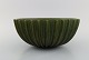 Arne Bang. Large bowl with fluted corpus decorated with green speckled glaze. 
1930/40