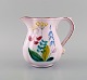Stig Lindberg for Gustavsberg Studio Hand. Jug in glazed faience with 
hand-painted flowers. 1940s.
