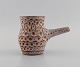 European studio ceramicist. Unique jug in glazed stoneware. Beautiful glaze in 
bright earth tones. 1960s / 70s.
