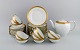 Royal Copenhagen White Dagmar tea service for 10 people in hand-painted 
porcelain with gold decoration. 1930s.

